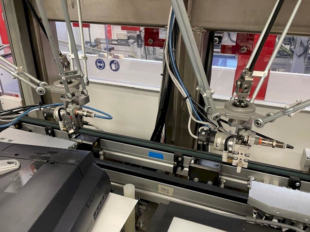 Vista frontal de la máquina IMS Tattoo Assembly Line