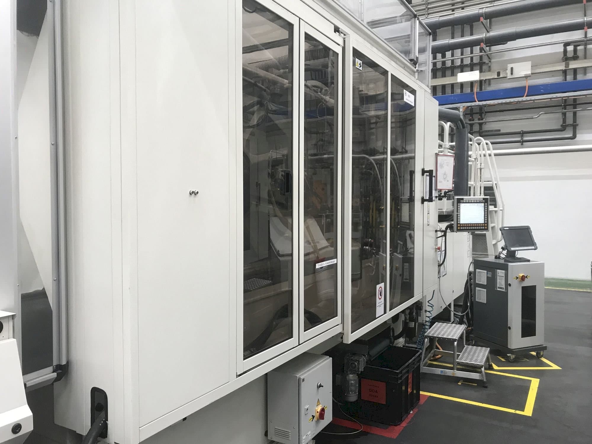 Vista lateral izquierda de la máquina Husky H500 RS 65/60