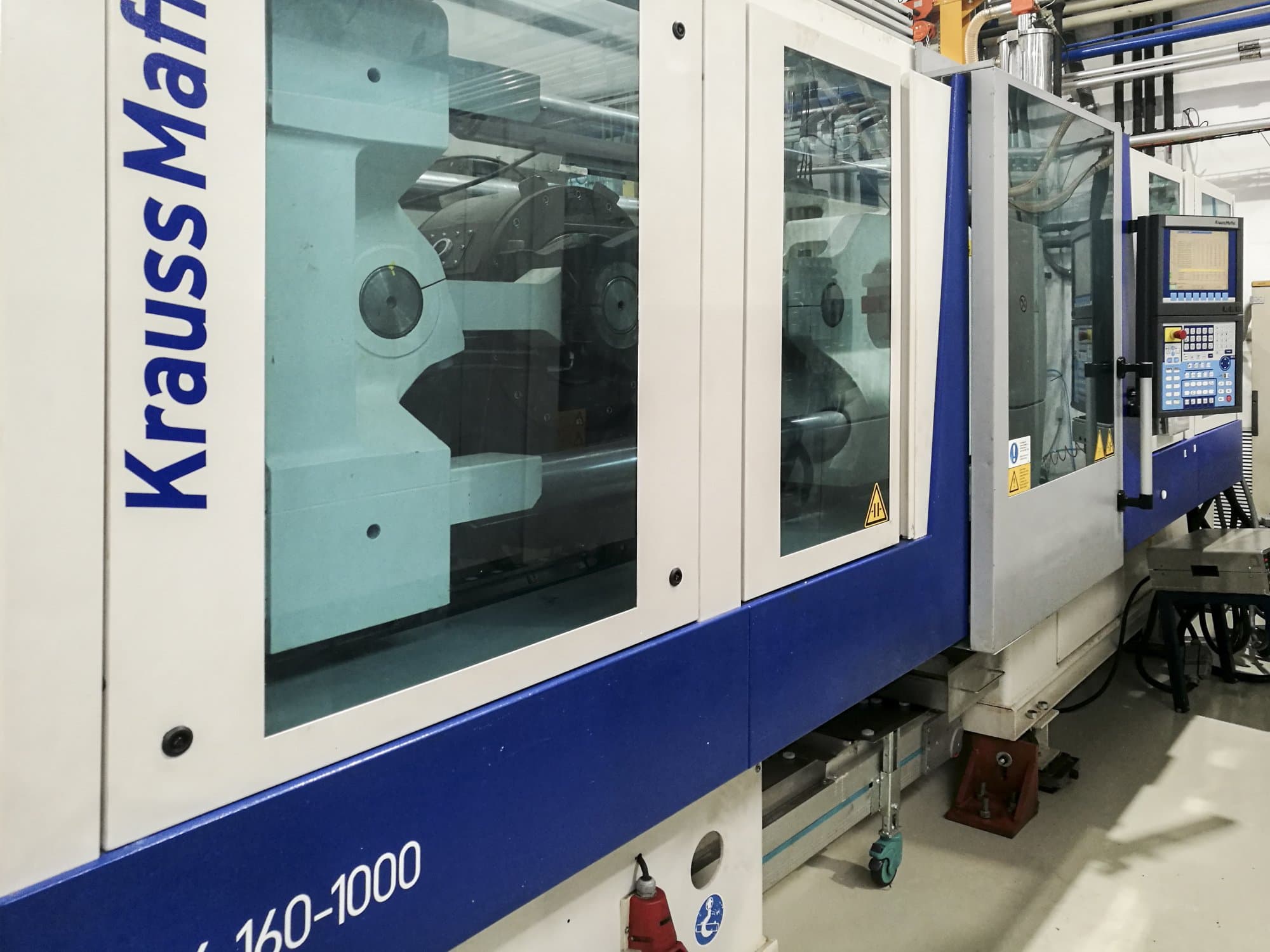 Vista izquierda de la máquina Krauss Maffei 160-1000 EX