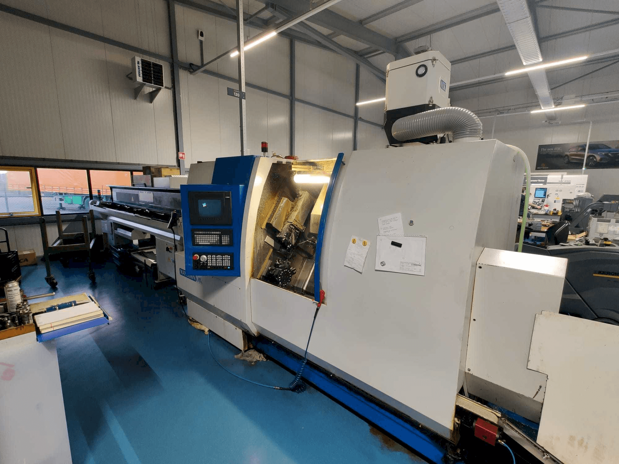 Vista frontal de la máquina Manurhin K'MX XL 32