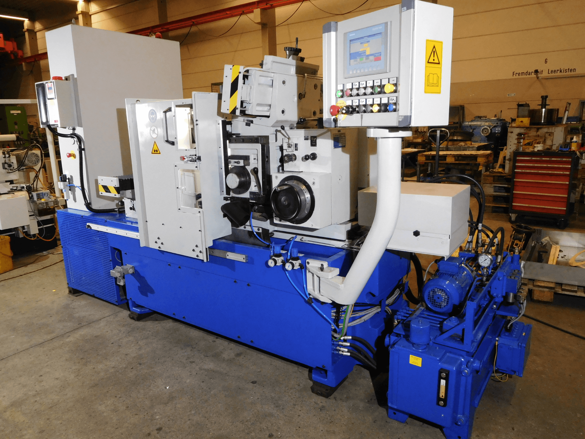 Rectificadora sin centros Schaudt Mikrosa SASL 125, vista lateral, con controles y cuerpo azul industrial con componentes de motor.