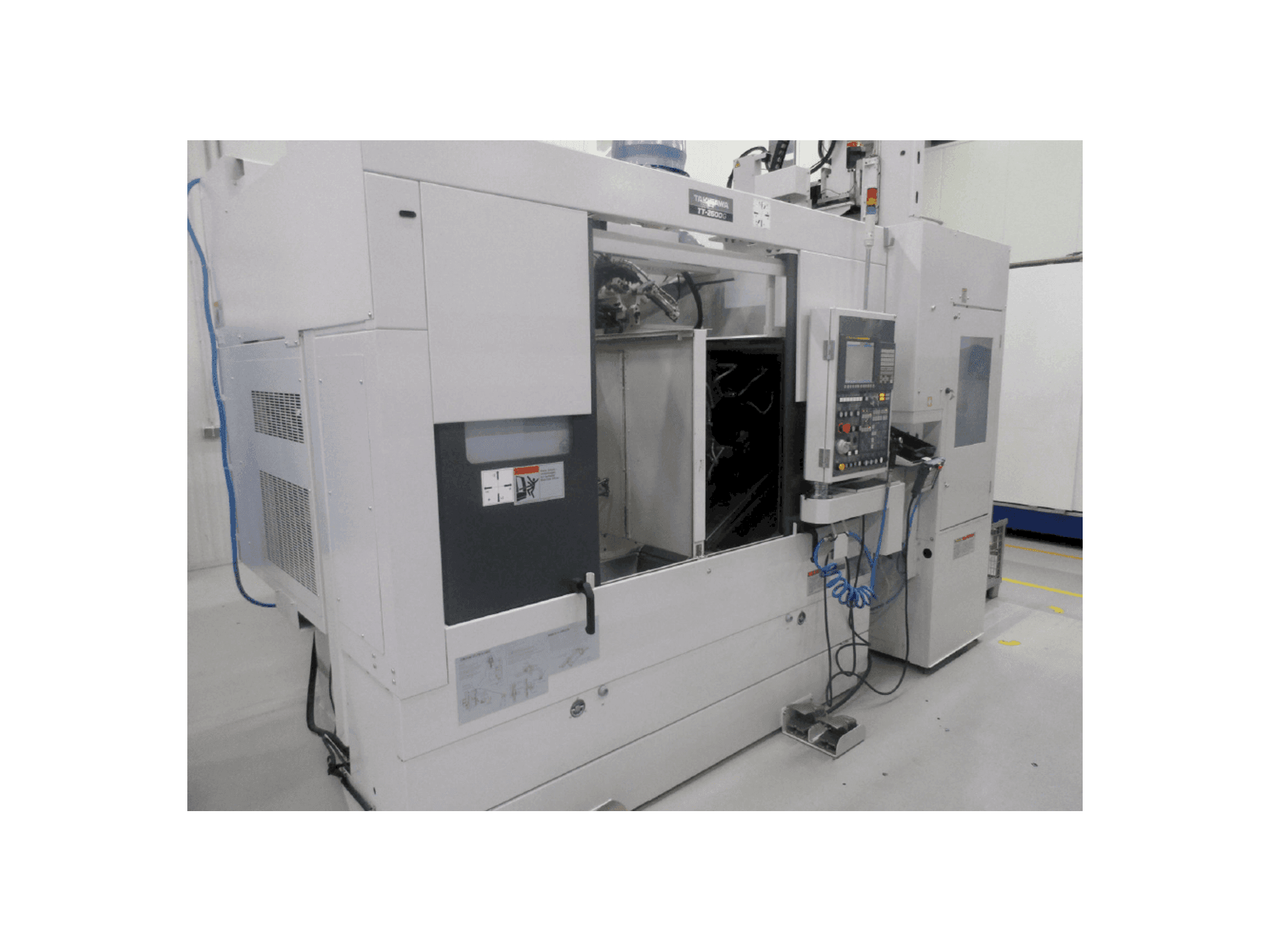 Vista frontal de la máquina Takisawa TT-2600G