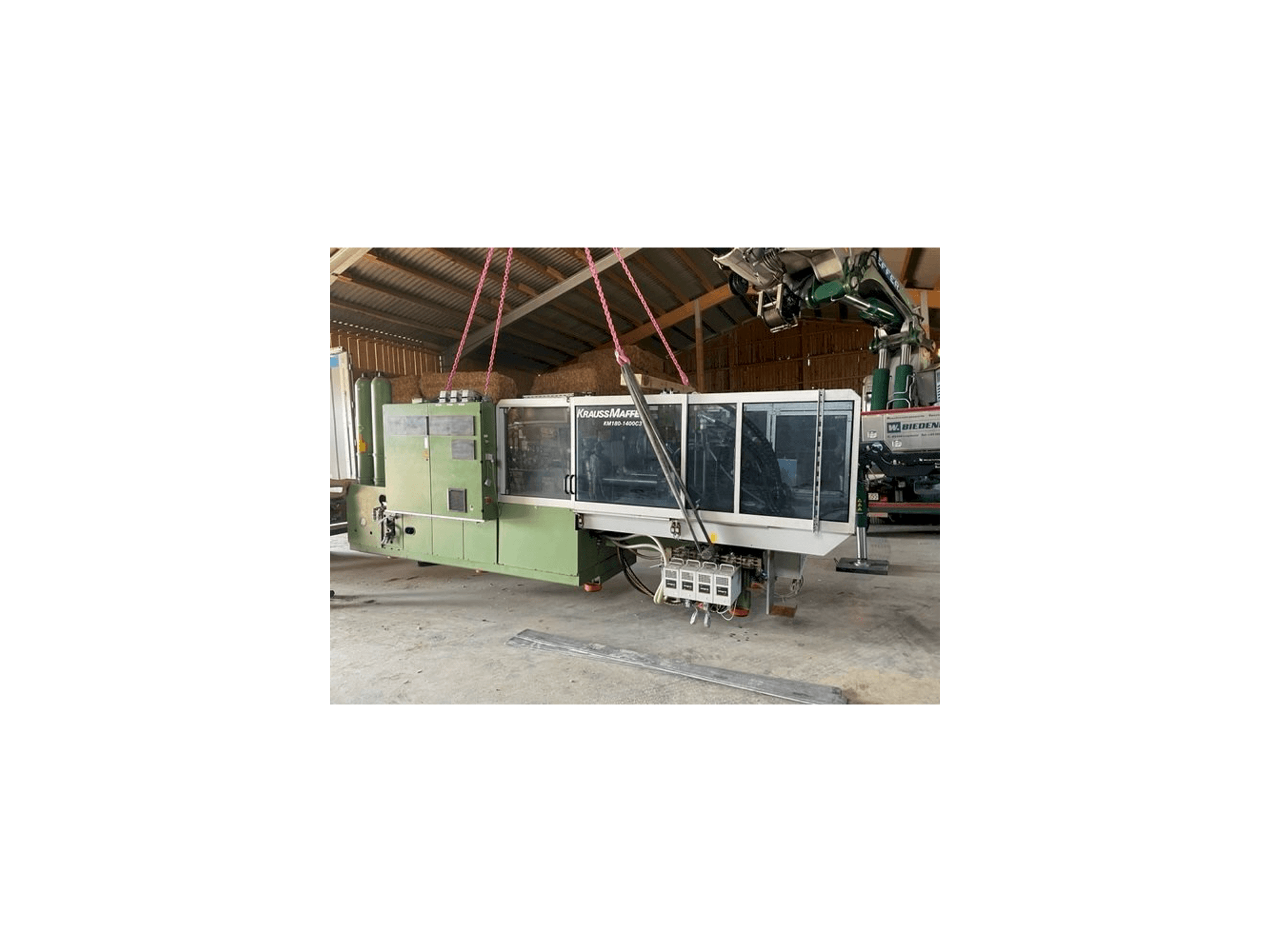 Vista frontal de la máquina Krauss Maffei KW180 C3 hybrid