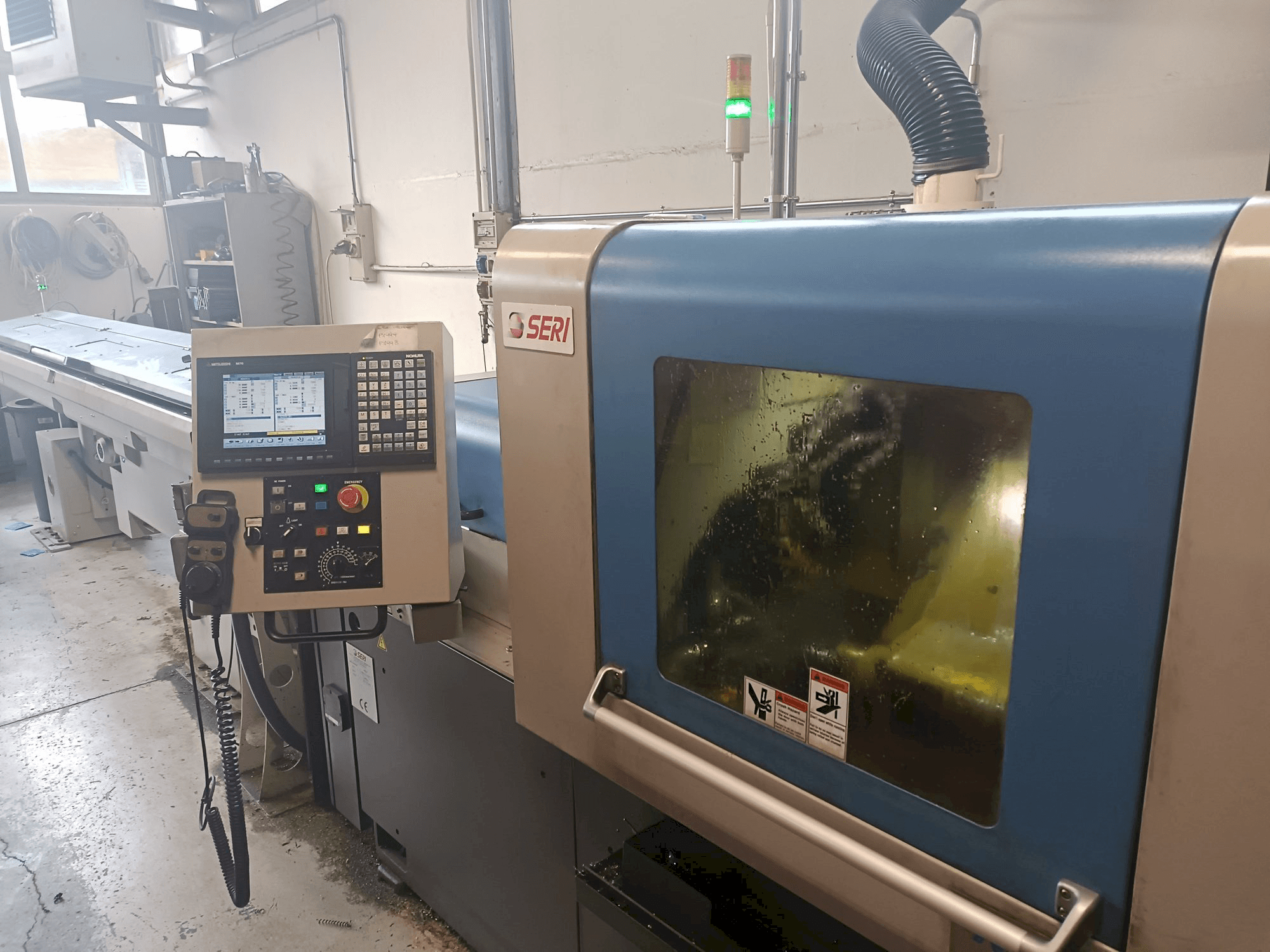 Vista frontal de la máquina NOMURA