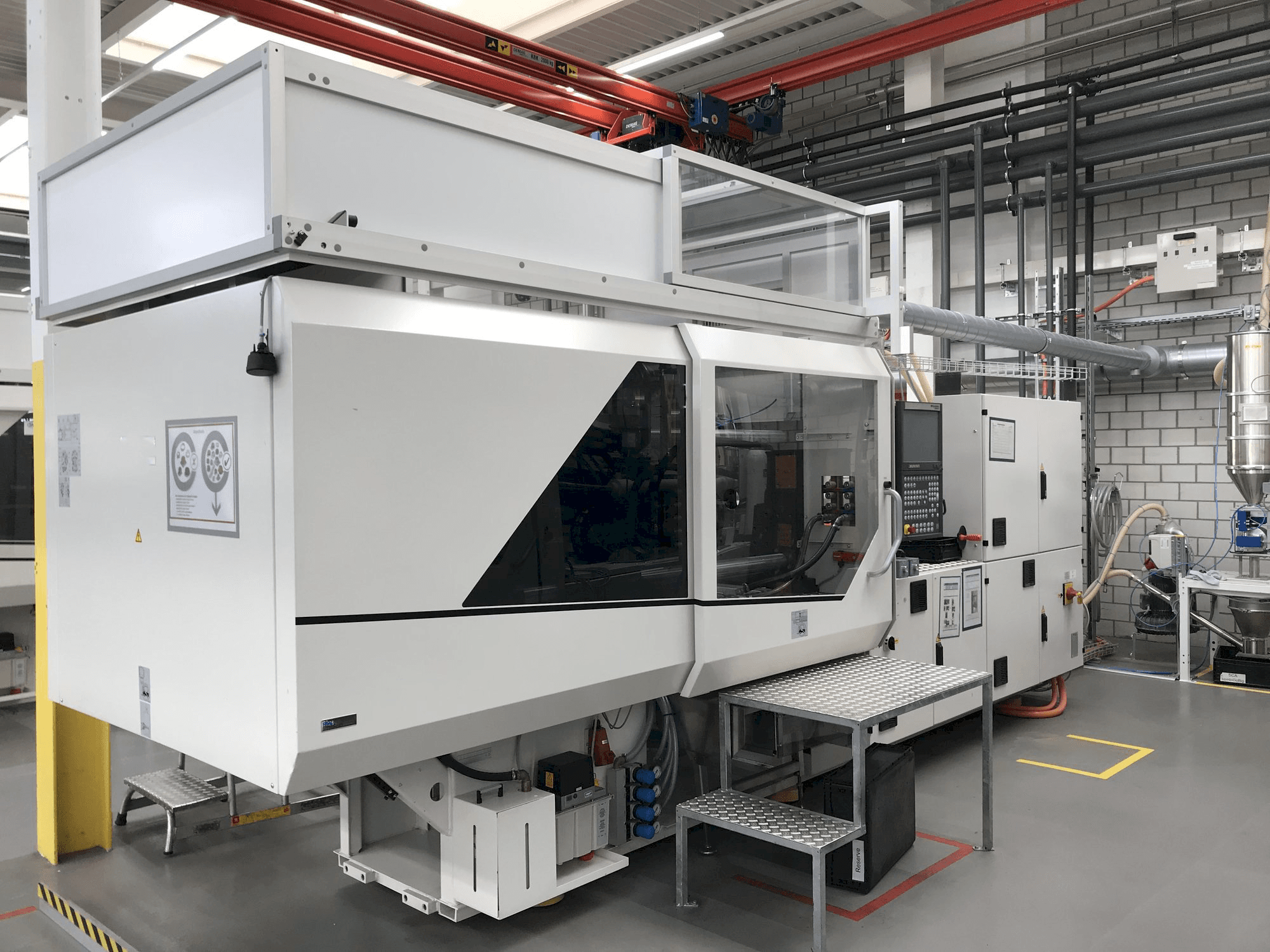 Vista lateral izquierda de la máquina Sumitomo Demag EL-EXIS SP 150/500-475