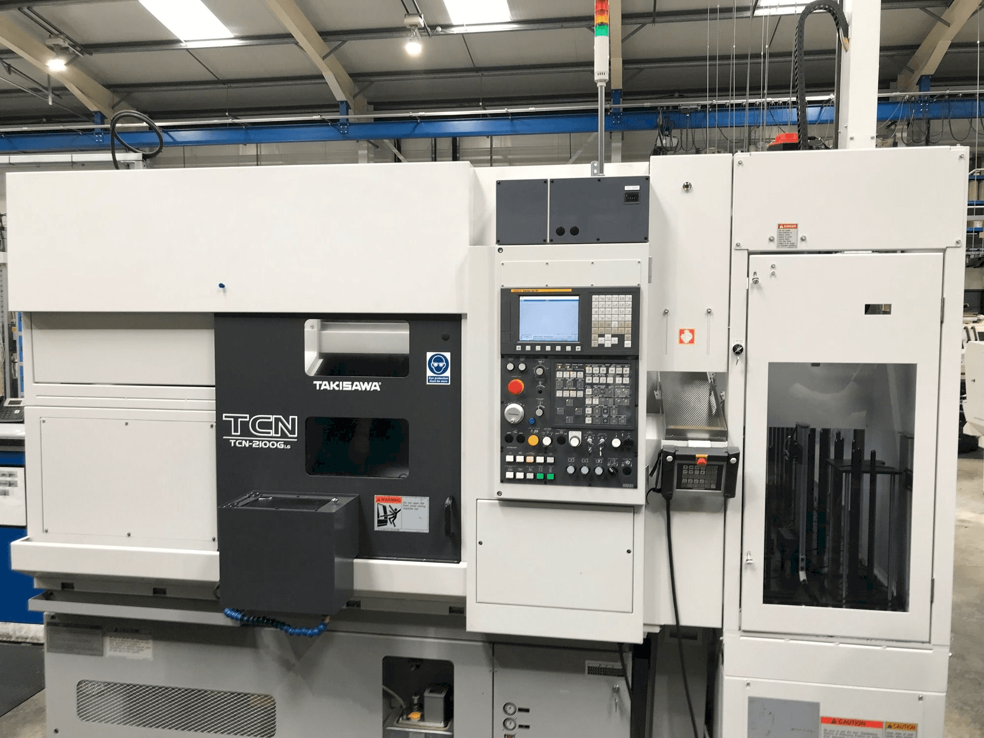 Vista frontal de la máquina Takisawa TCN-2100G L6