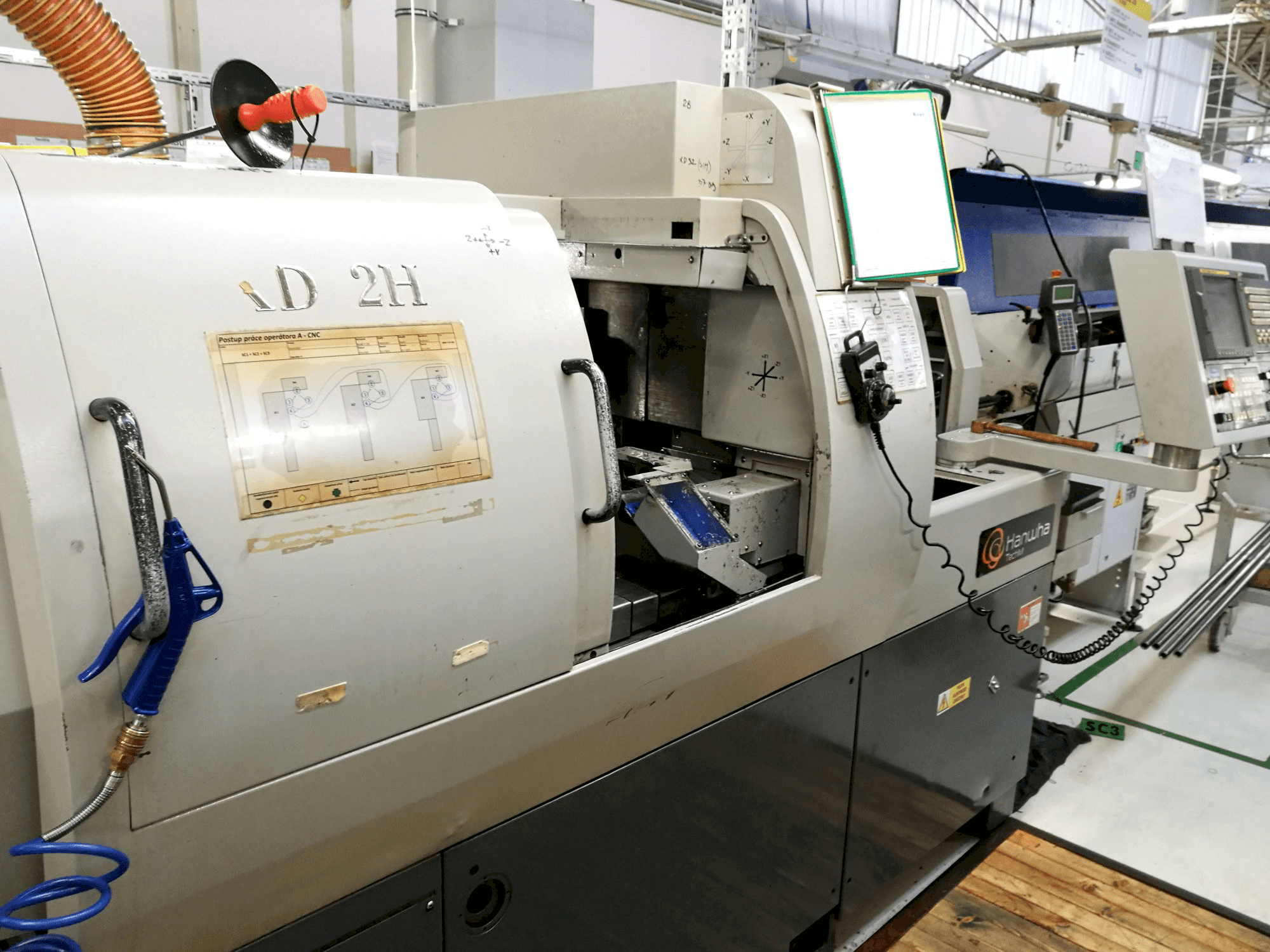 Vista derecha de la máquina Hanwha XD 32 H