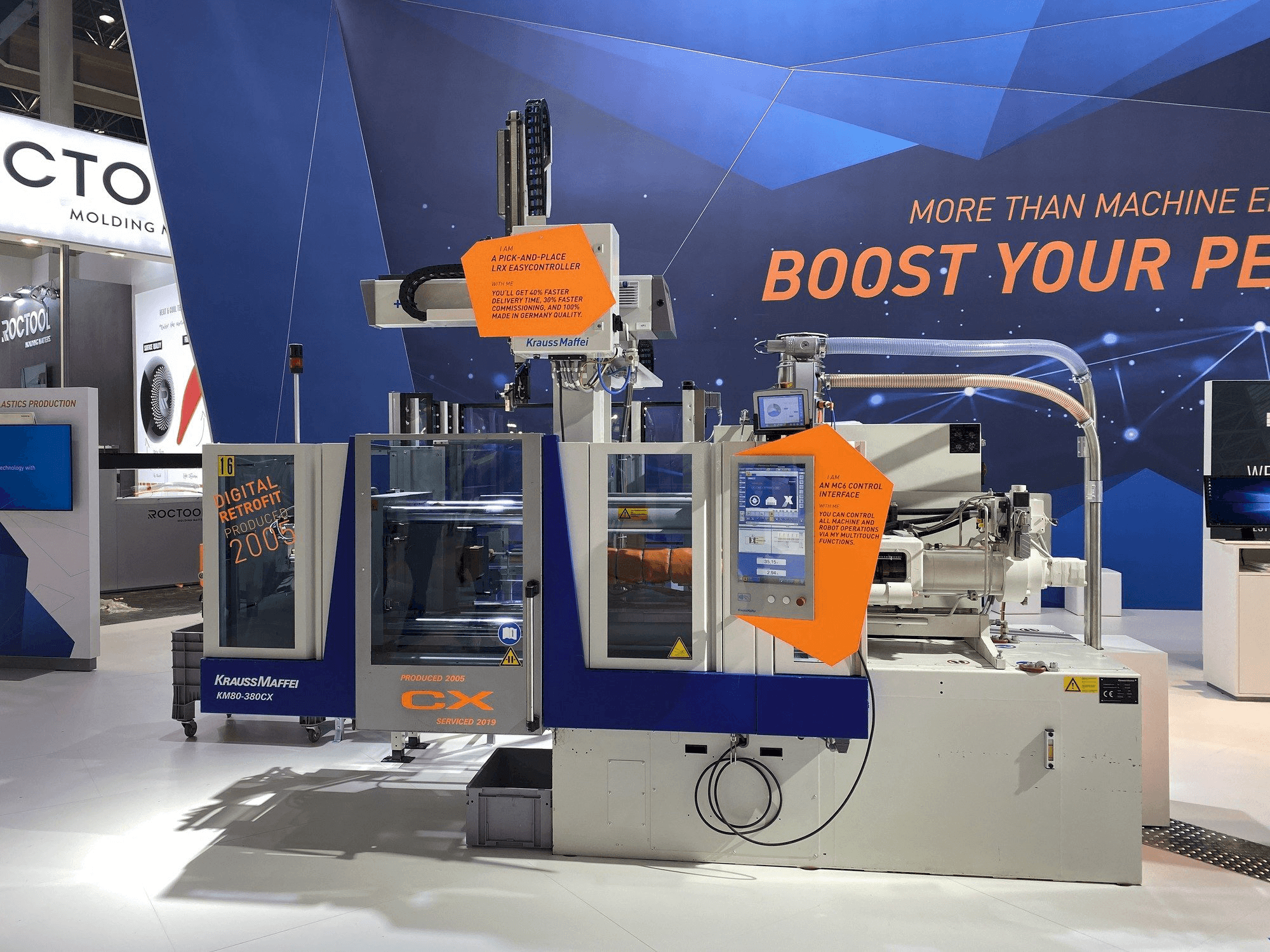 Vista frontal de la máquina Krauss Maffei 80-380 CX + LRX easyControl 100